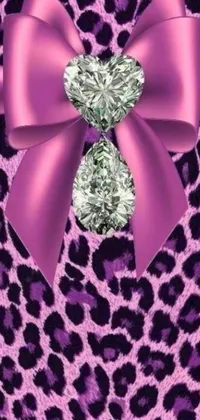 This live wallpaper for your phone features a stylish and lively design, with a close-up shot of a pink bow set against a leopard print background