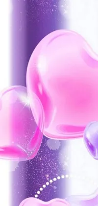 This live wallpaper for your phone features pink heart bubbles set against a pretty purple background