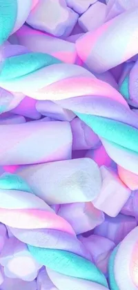 Experience the magic of a pastel-colored, Tumblr-inspired wallpaper with this lively Marshmallow live wallpaper for your phone! Watch a mesmerizing close-up of fluffy white, pink, blue and yellow marshmallows bounce and shift as the twirls and swirls of a charming and whimsical pastel purple background edge around them