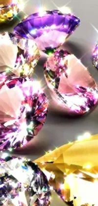 This phone live wallpaper features a variety of colorful diamonds scattered on a table