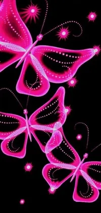 This live wallpaper displays three stunning pink butterflies floating on a dark background