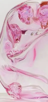 Enhance your phone screen with this visually stunning live wallpaper featuring a pink glass vase