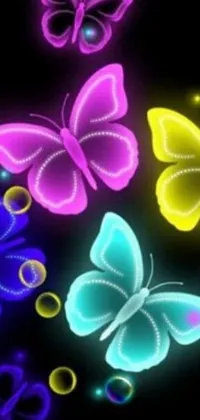 This live phone wallpaper features a group of vibrant butterflies set against a black background
