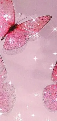 This phone live wallpaper displays a group of elegant pink butterflies in flight against a romantic backdrop complete with sparkling crystals and glitter