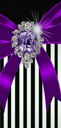 This stunning live phone wallpaper showcases a beautiful purple bow set against a bold, monochrome striped background