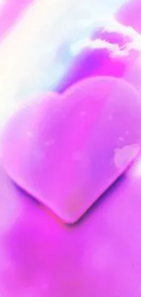 This stunning phone live wallpaper features a pink heart resting on a fluffy bed