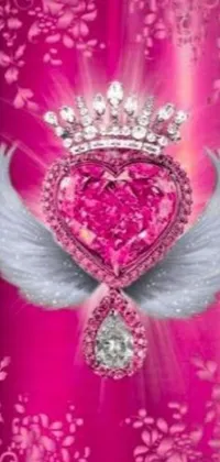 Adorn your phone screen with this stunning live wallpaper featuring a winged heart with a crown and glittering rubies