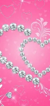 Adorn your phone with a stunning live wallpaper featuring a diamond heart placed on a pink background