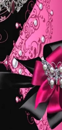 This phone live wallpaper features a stunning pink and black invitation design with pearls and a butterfly