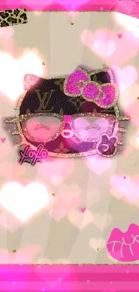 This Hello Kitty live wallpaper features a cute character against a pink background with glitter accents