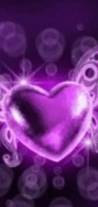 This phone live wallpaper showcases a stunning heart with wings against a captivating purple backdrop