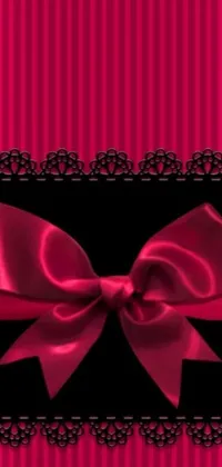 This phone live wallpaper features a stunning pink and black striped background with a cute bow