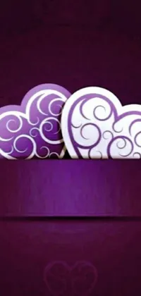 This stunning phone live wallpaper features a beautiful vector art design of purple hearts stacked atop each other, exuding a romantic and whimsical feel
