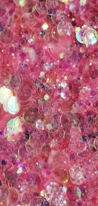 Looking for a playful way to decorate your phone screen? Check out this unique live wallpaper! It features a pile of shimmering pink glitter, a colorful album cover, artsy pointillism, and ornate crystal jelly designs