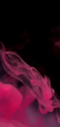 Introducing a stunning phone wallpaper featuring a captivating close-up of pink smoke on a pitch-black background