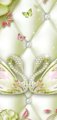 This stunning live wallpaper features a pair of majestic swans perched atop a quilted wall surrounded by crystal-studded flowers in hues of pink, white, and green