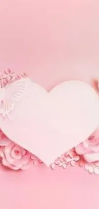 This phone live wallpaper features a delightful paper heart surrounded by a variety of beautiful flowers, creating a charming and romantic scene