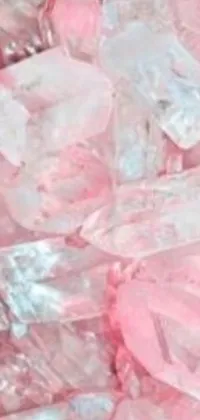 This chic live wallpaper showcases a delightful spread of pink candy piled up on a table