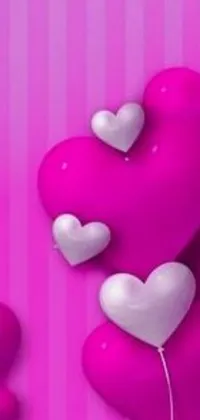 This phone live wallpaper features heart-shaped balloons set against a pink background