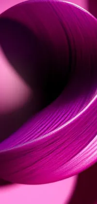 This captivating live wallpaper showcases a stunning high-detail macro photograph of a sleek, curved object resting on a bold pink surface