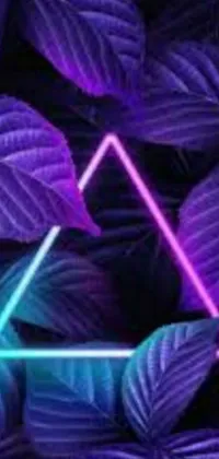 Looking for a cool new phone wallpaper? Check out this trendy design featuring a neon triangle amidst a backdrop of purple leaves