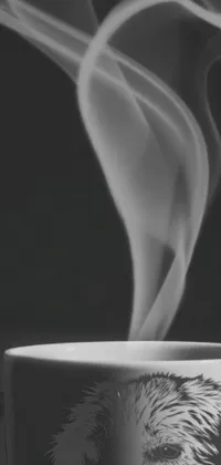 This phone live wallpaper depicts a close-up shot of a smoking cup of tea