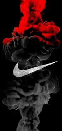 Looking for a bold and striking live wallpaper for your phone? Look no further than the Nike Red Smoke live wallpaper! With a sleek black and white design and a vibrant red smoke cloud, this wallpaper is sure to make an impact