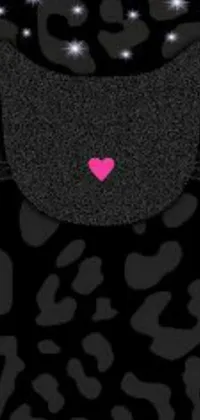 Elevate your phone screen with a captivating live wallpaper featuring a black cat holding a pink heart in its mouth