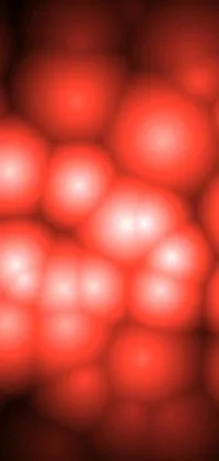 This phone live wallpaper features a stunning close-up of red balls, generated through a reaction-diffusion pattern