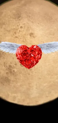 This stunning live wallpaper features a red heart with wings against a background of a full moon in a dreamy atmosphere
