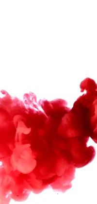 This stunning and abstract phone live wallpaper features a close-up view of red substance dissolving in water, creating a smoky cloud effect
