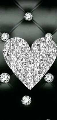 This phone live wallpaper showcases a striking black and white image of a diamond heart, featuring crystals on the walls and diamond skin