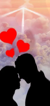 This live wallpaper showcases a romantic moment between two silhouettes in a heavenly setting