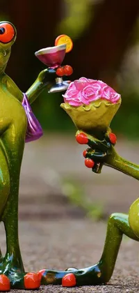 This lovely phone live wallpaper depicts two frogs in a charming display of affection