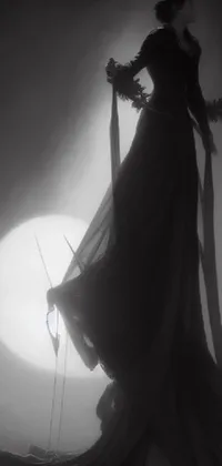 This live wallpaper features a stunning black and white photo of a woman in a dress holding a moon on a stick