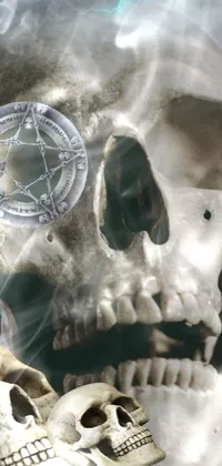 This phone live wallpaper features intricately detailed skulls sitting on a table with a vintage portrait, pentacle, and mystical background infused with lightning and fire elements