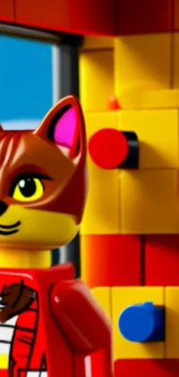 Introducing a stunning live wallpaper for your smartphone that will bring your screen to life! This high-quality wallpaper features an adorable LEGO cat standing gracefully in front of a window, with a beautiful picture in the background