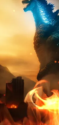 This phone live wallpaper depicts the famous Godzilla monster in front of a mountain with a burning city in the background