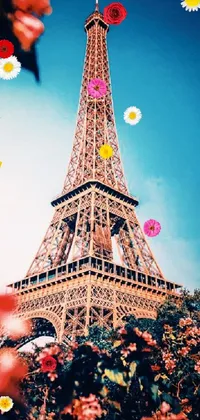 This live wallpaper for your phone features a vibrant colorized photo of the Eiffel Tower, surrounded by pink flowers