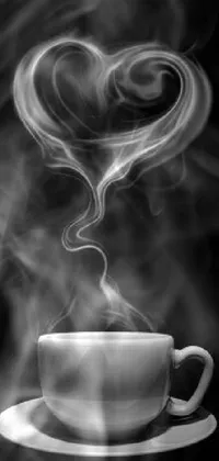 This phone live wallpaper features a stunning black and white image of a steaming cup of coffee, clouds and hearts in the background