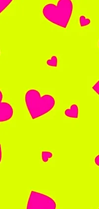 This lively phone live wallpaper boasts a green background speckled with a profusion of pink hearts, designed to grab visual attention