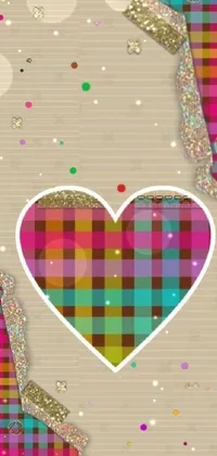 This charming phone live wallpaper is a digital artwork featuring a heart on a piece of paper, tartan, sand, and glitter