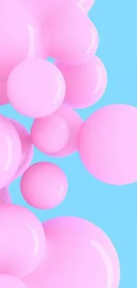 This phone live wallpaper features a delightful scene of pink balloons floating effortlessly in soft blue and pink tints