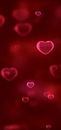 Looking for a romantic and beautiful live phone wallpaper? Check out this high-quality 4K wallpaper featuring a bunch of pink hearts floating in the air