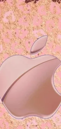 This phone live wallpaper is a true visual treat, featuring a striking close-up of the ever-famous apple logo on a stunning pink background