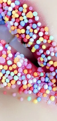 This live wallpaper showcases a mouth-watering, close-up shot of a colorful doughnut with sprinkles