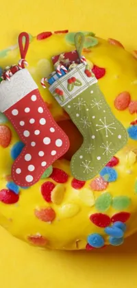 This Christmas-themed live wallpaper features a doughnut designed to look like a festive stocking with red and yellow icing