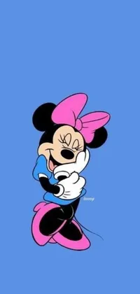 Add a fun and vibrant touch to your phone with this lively live wallpaper! Featuring an adorable cartoon rendition of Minnie Mouse, the popular Disney character, against a bright blue backdrop, adorned with hints of pink and pops of black lines that lend an overall pop art feel to the image, this wallpaper is sure to delight fans of all ages