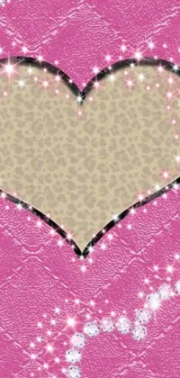 This phone live wallpaper is a stunning design featuring a sparkling heart on a pink background
