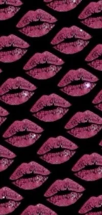 This phone's live wallpaper features a pattern of pink lips set against a black background, adding a chic and stylish touch to your phone